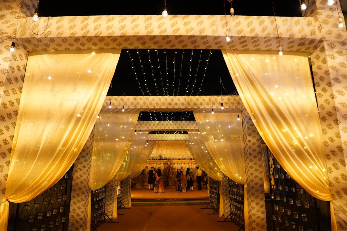 Golden draped wedding walkway